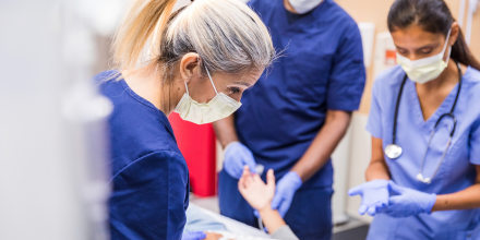 Doctors talking to the patient